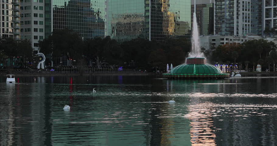 Sunset view of the downtown skyline and Lake Eola of Orlando, Florida, USA.
