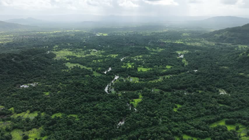 Aerial view of the mountainous landscape surrounding historic Raigad Fort in Maharashtra, India.