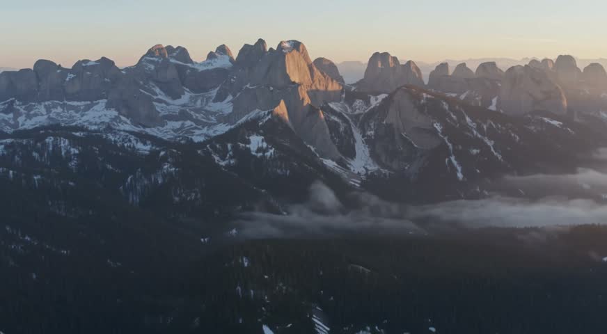 Arieal view of mountains in winter. A breathtaking aerial view of mountains blanketed in winter snow, captured from a bird