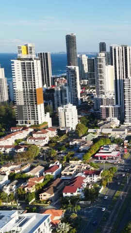 High-angle aerial shot of skyscrapers and residential areas in Surfers Paradise, Gold Coast, Australia.