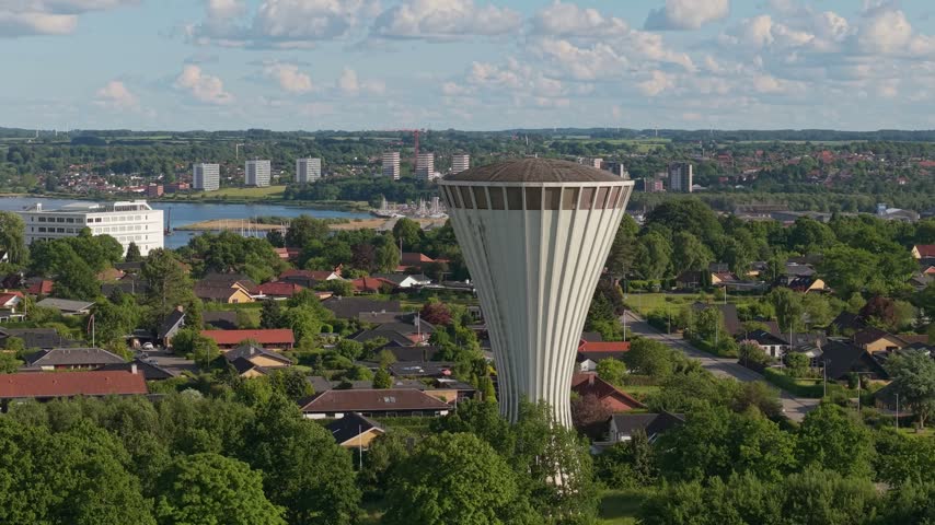 Aerial footage circling the iconic mushroom-shaped water tower on Sjaellandsvej, showcasing Kolding