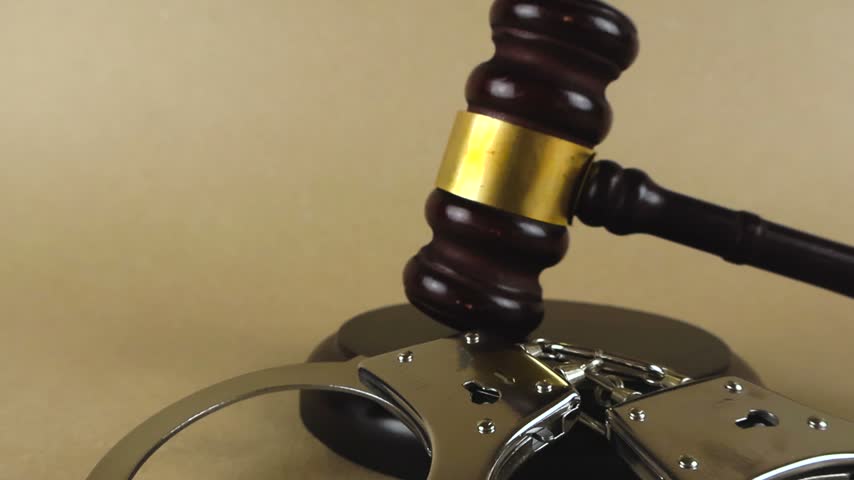 Courtroom scene depicting a wooden judge