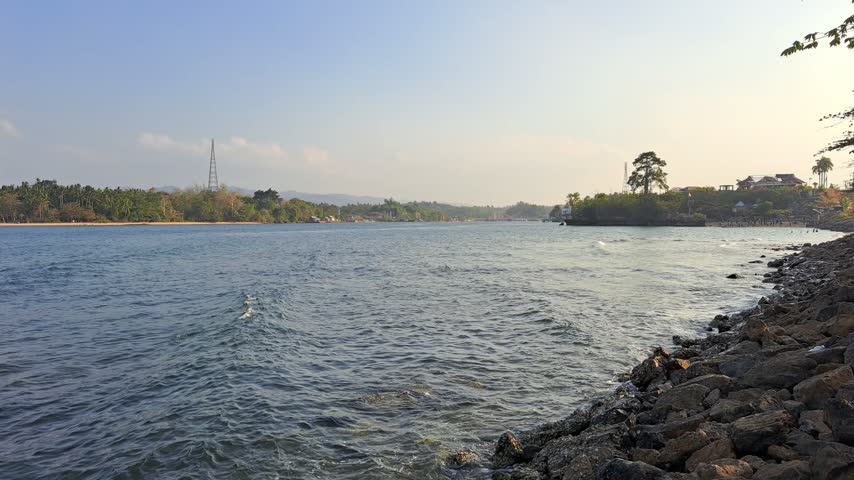 Riverside scene under clear skies