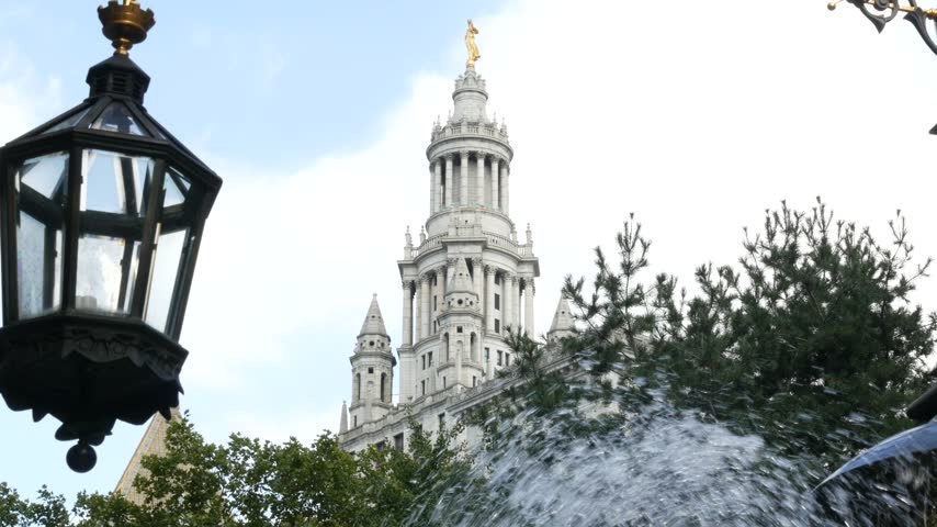 New York City Downtown Civic Center, United States of America. Manhattan municipal building 1914, old historic architecture. Government administration authority from City Hall park. Fountain, lantern.