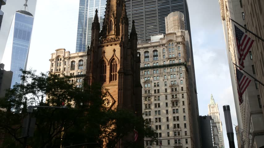 New York City Manhattan Downtown Financial District, United States of America. World Trade Center skyscraper, FiDi tower building. Modern business center, Trinity church 1846 from Broadway. Religion.