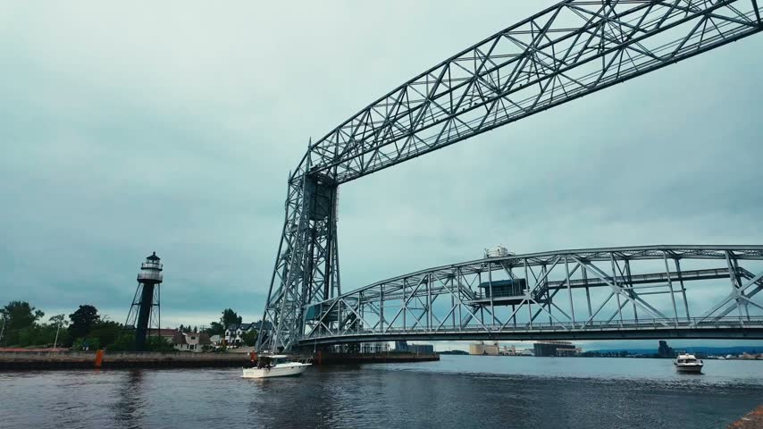 A timelapse of an aerial bridge in Duluth, Minnesota rising and allowing boats to pass under it.