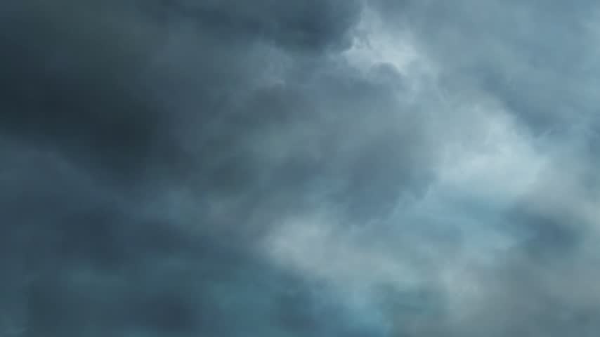 Dark Storm Clouds with Lightning Flashing Across the Sky