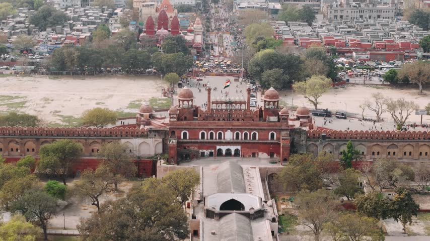 Aerial view of the historic red fort in old delhi, india, revealing the lahori gate and surrounding cityscape.
