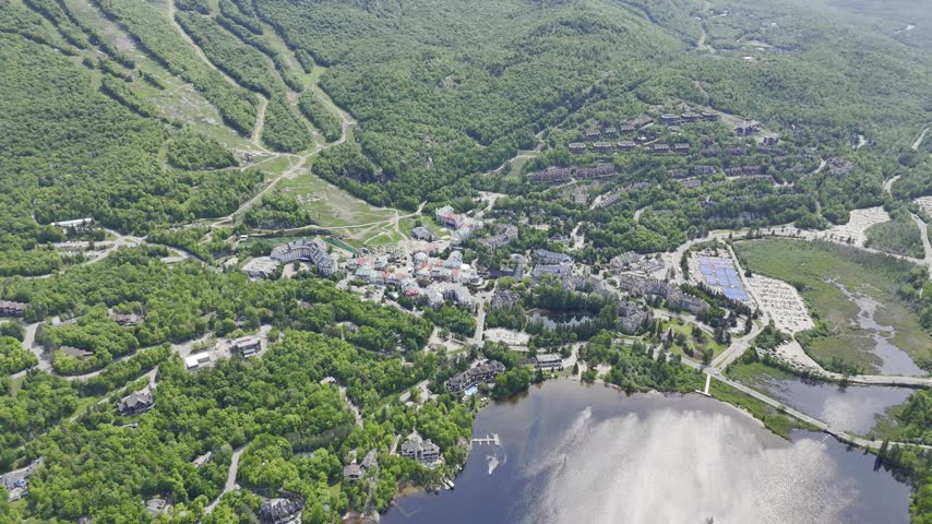 Aerial view of Mont Tremblant resort village, Quebec, Canada with lake, forest and mountain landscape in summer. g.