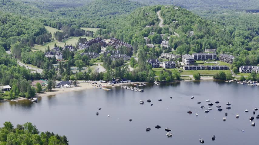 Aerial view of Mont Tremblant resort village, Quebec, Canada with lake, forest and mountain landscape in summer. g.