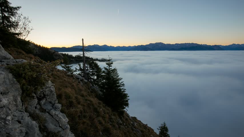 Sunrise in the mountains above the clouds