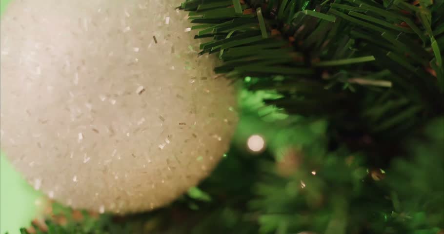 Sparkling Christmas Tree with Shining Ornaments and Glittering Lights, Festive Holiday Decoration Close Up