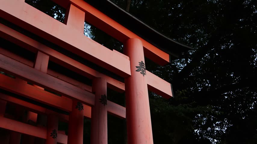 Close architectural view of the iconic vermilion torii gates at Fushimi Inari Taisha in Kyoto, Japan, highlighting the repeating forms of the sacred Shinto shrine pathway