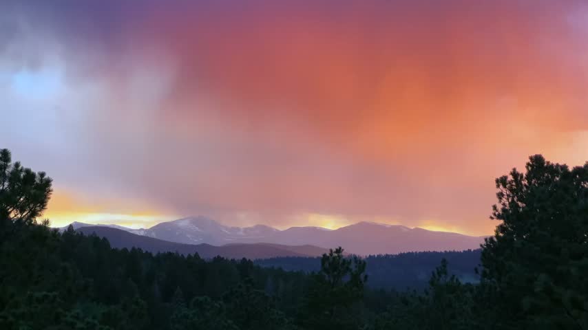 Mount Blue Sky rain sunset golden hour vibrant orange dark clouds vibrant orange sky spring snow Mt Blue Sky Evergreen Colorado landscape Front Range Rocky Mountains peaks Mount Evans Wilderness