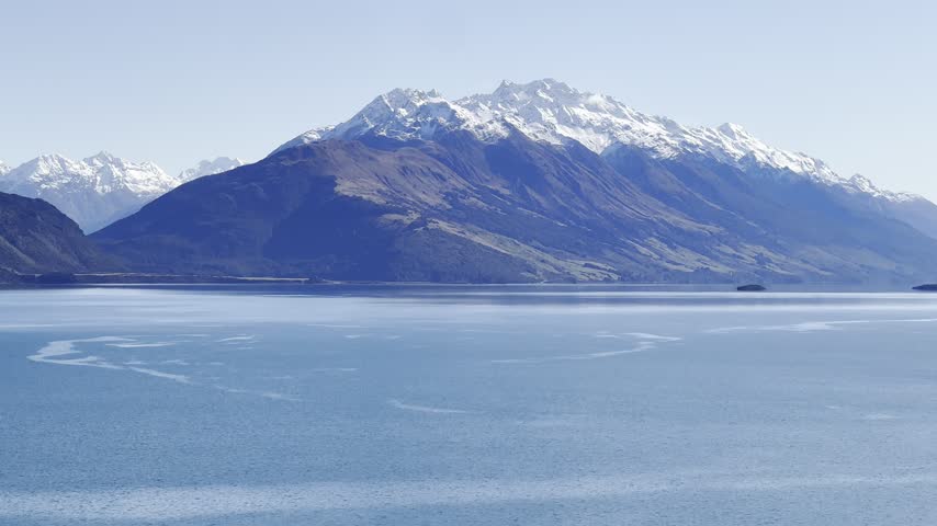 Landscape with snowy mountain and still lake