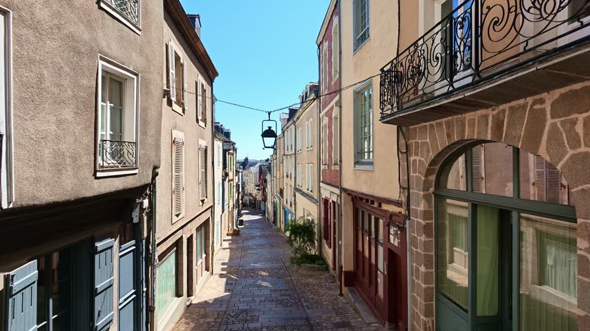 Grande Rue with its traditional architecture, colorful facades, and cobblestone street in Laval, France