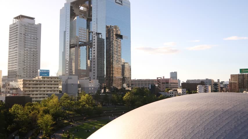 View of the Umeda Sky Building rising among modern high-rise architecture in Osaka, Japan, showcasing the contemporary skyline of the city’s major business district