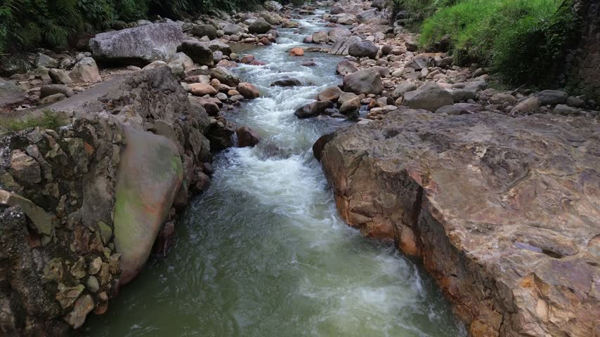 Clear Mountain Stream Flowing Through Rocky Riverbed