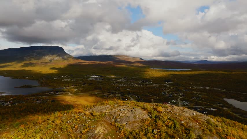 Aerial view around people on the Salmivaara hill, fall day in Kilpisjarvi, Finland
