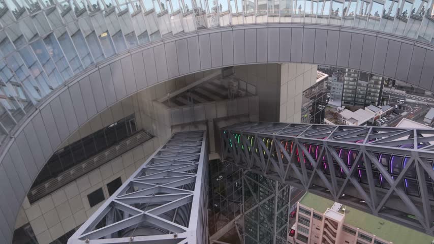 Modern architectural details of the Umeda Sky Building during sunset in Osaka, Japan. Contemporary urban skyscraper exterior in the Kansai region