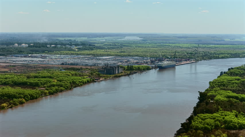Aerial view of the Zarate port and industrial waterfront along the Parana River in Buenos Aires Province, Argentina.