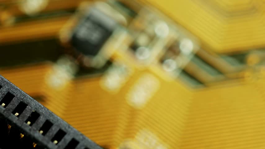 Macro shot of a motherboard with circuits and ports, representing high-definition computer hardware and data processing technology.