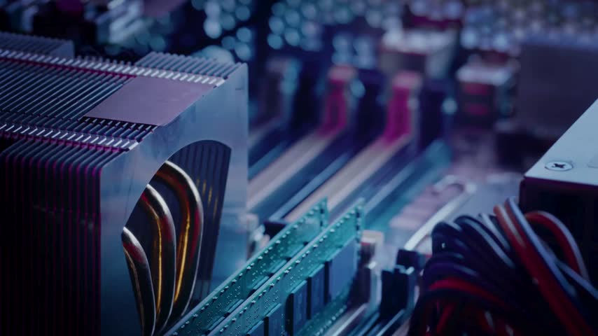 close-up of a gaming PC motherboard featuring RAM modules and a copper-pipe CPU heatsink. High-res gaming and technology concept background