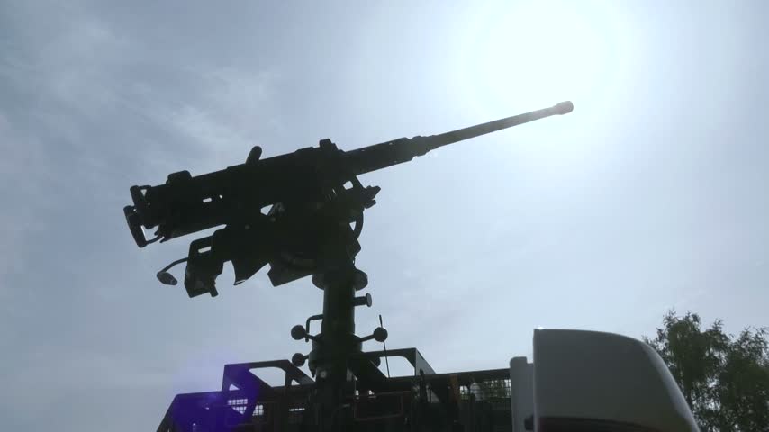 Machine gun mounted in the bed of a pickup truck against the sky, ready for combat duty. Mobile fire groups, air defense, counter-drone operations, protection of Ukrainian airspace, and defense against Shahed drone attacks during the Russo-Ukrainian War.