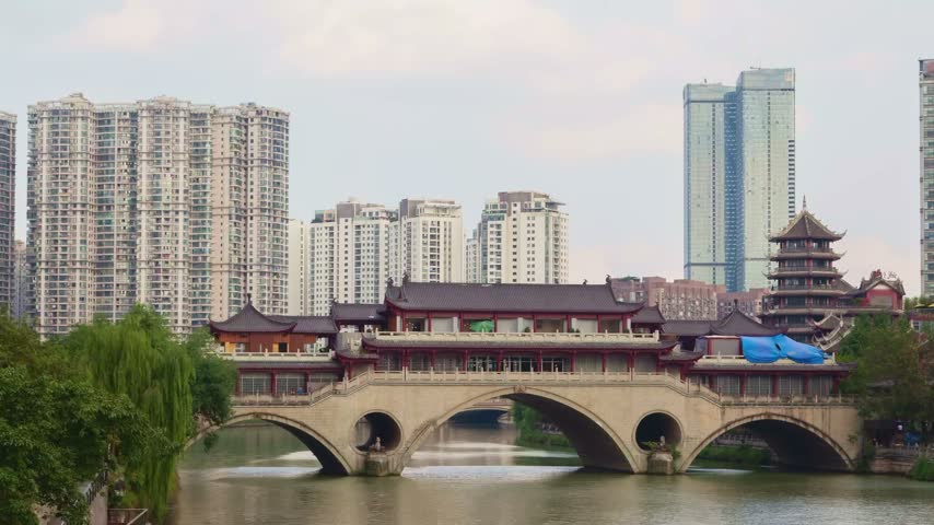 Anshun Bridge with traditional architecture and modern skyscrapers in Chengdu China daylight view