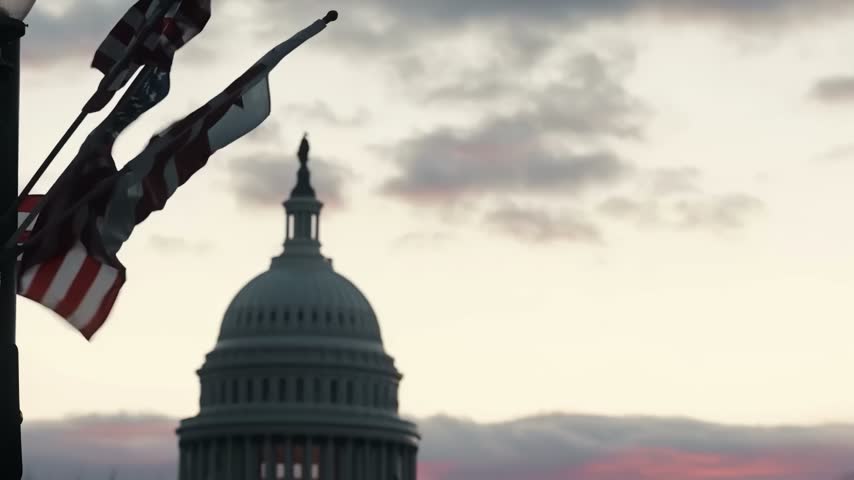 U.S. Capitol Dome and American Flags at Sunset in Washington, D.C.