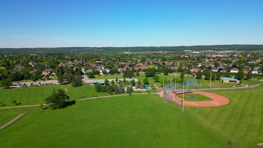 Millcroft Park in Burlington, Ontario, with baseball diamonds and a playground in aerial view