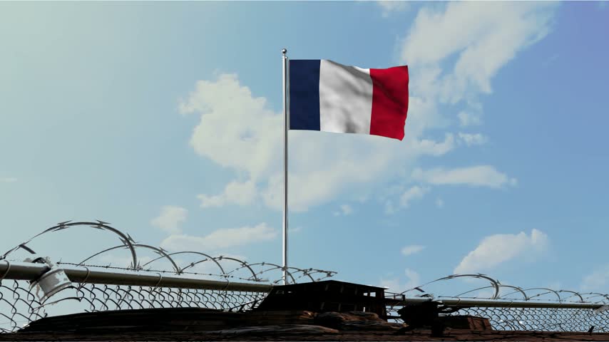 French Military Outpost with Waving Flag and Barbed Wire Fence
