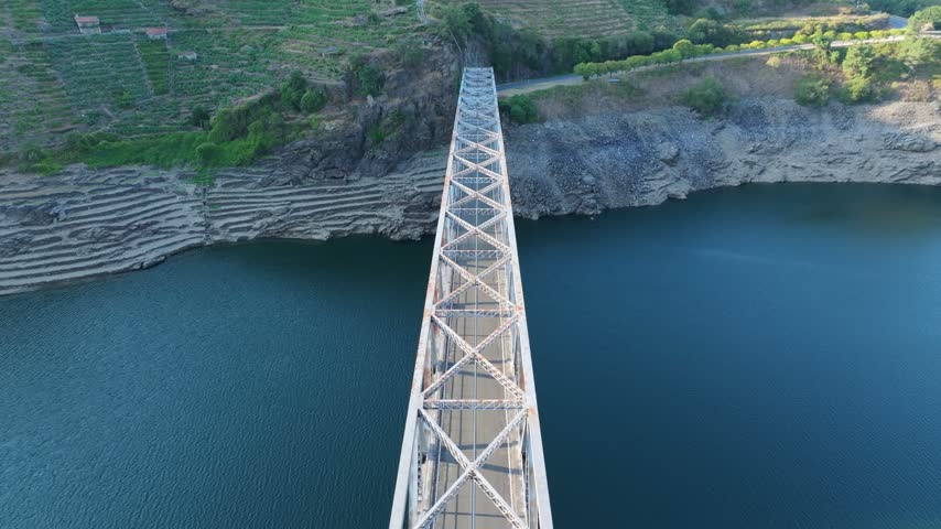 Ponte Mourulle Truss Bridge Over The Calm Waters Of Minho River In Lugo, Galicia, Spain. - aerial shot