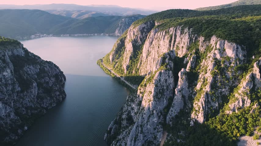 Aerial view flying over the Danube river gorge Iron Gates, nestled between the Carpathian Mountains of Romania and Serbia in Djerdap National Park