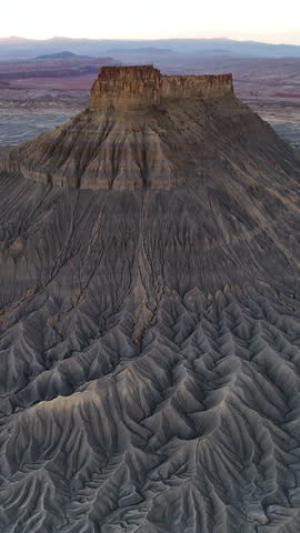 Vertical Drone Shot of Factory Butte, Famous Sandstone Rock Formation and Natural Landmark of Utah USA