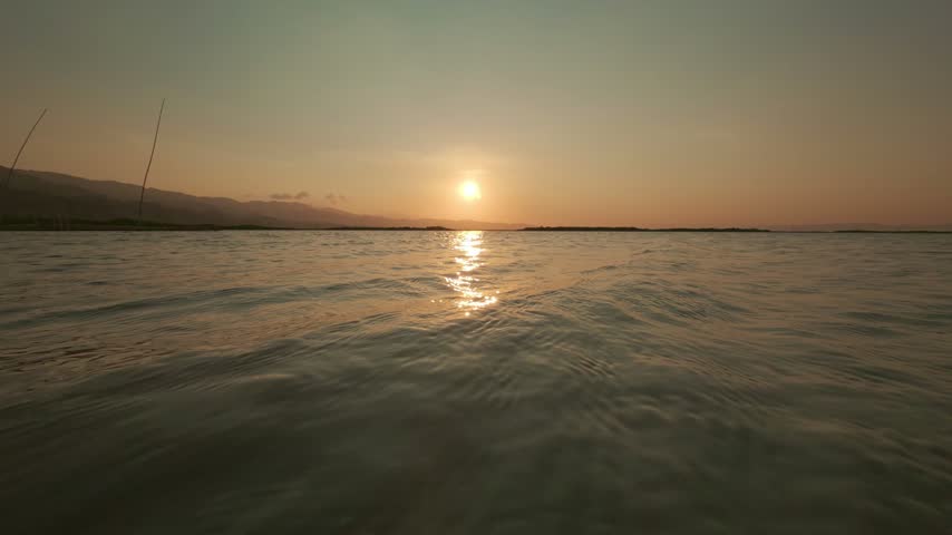 Scenic Sunset Over Calm Lake Water