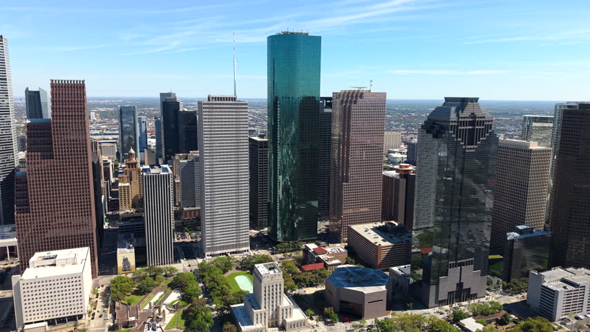 Aerial panorama of Houston urban core with contemporary office towers and highways. Texas major city center offers striking architectural landscape.