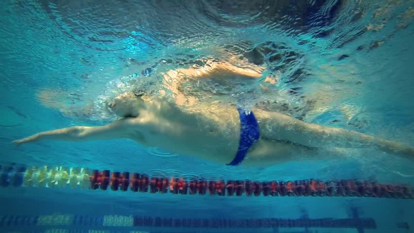 Beautiful underwater slow motion view of swimming free style