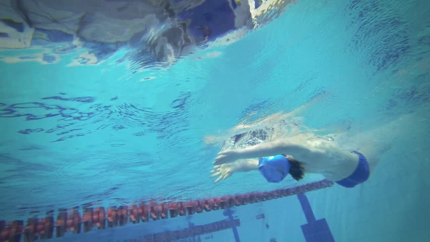 Beautiful underwater slow motion view of swimming backstorke style