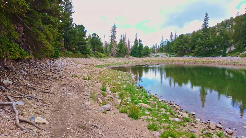 Sunny panoramic view of pristine Teresa Lake along the Alpine Lakes Loop trail in Great Basin National Park Nevada