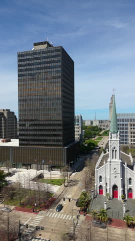Baton Rouge cityscape featuring St. Joseph Cathedral, the Louisiana State Capitol, urban skyline, historic district and downtown business center.