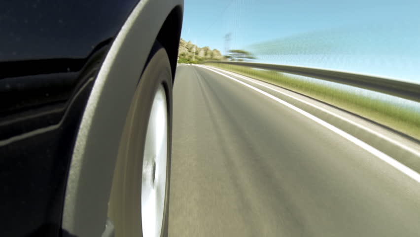 Timelapse view of car on the speed at the beautiful road with mountains.