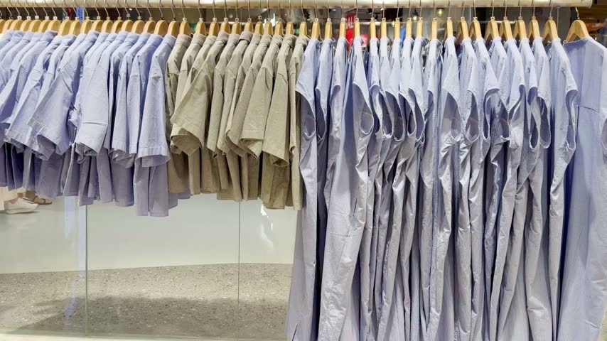 Assorted Casual Clothes on Store Racks	
