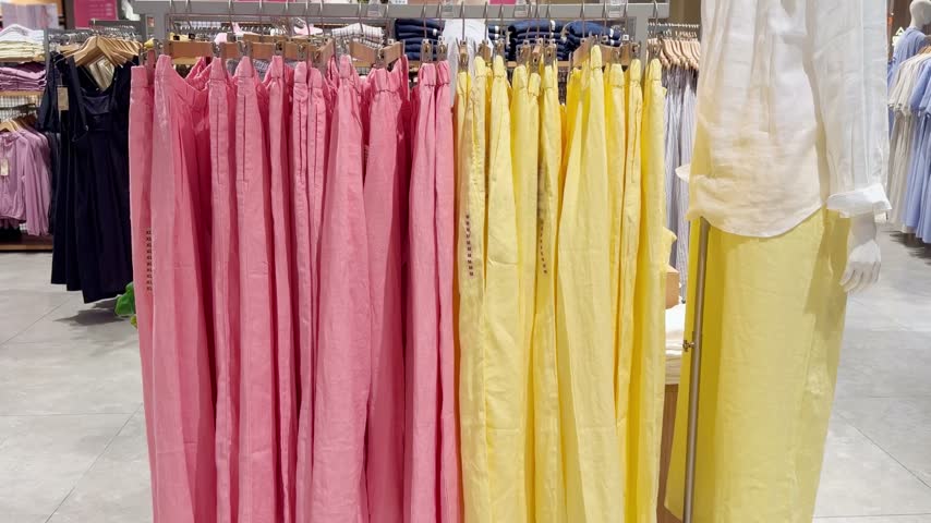 Assorted Casual Clothes on Store Racks	
