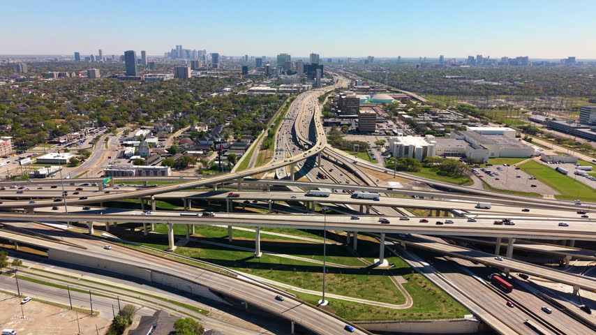 Houston, Texas. Modern city skyline with expressway stretching across urban landscape. USA transportation concept.