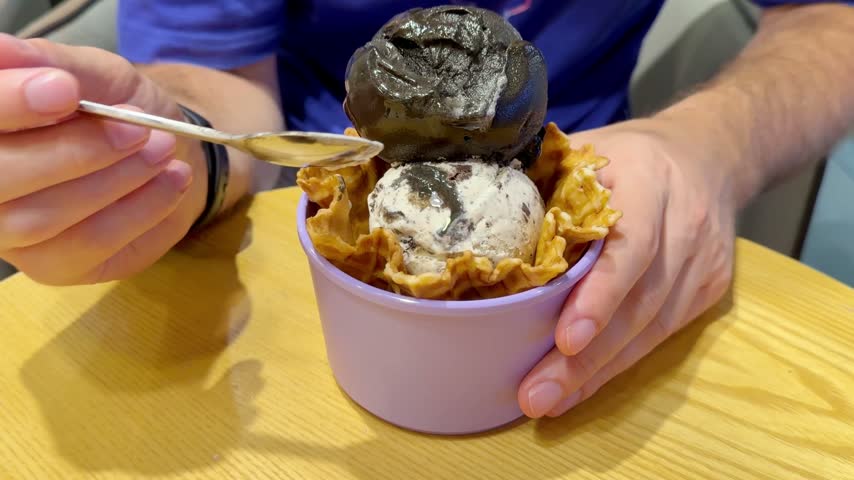 Close Up of Ice Cream Scoop in Bowl with Hand Holding Spoon ,Sweet Dessert	
