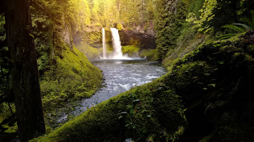 Aerial shot of the amazing Koosah Falls and lush moss covered forest on the McKenzie River in Oregon.