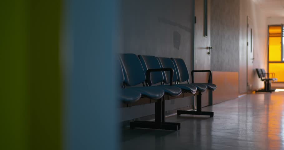 Empty Waiting Chairs in Old Public State Hospital Corridor