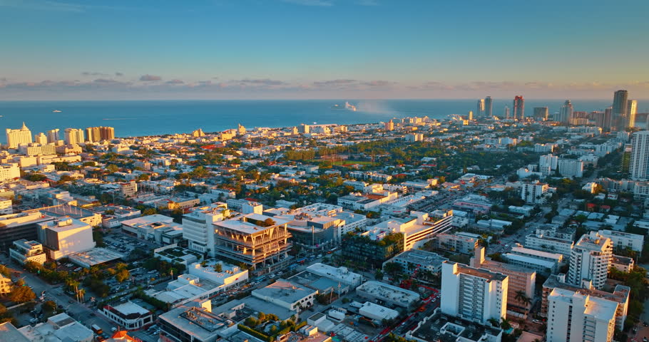 Cityscape of gorgeous Miami, Florida, USA with multiple cars on the roads. Scenery of the lively city at sunset. Aerial view.
