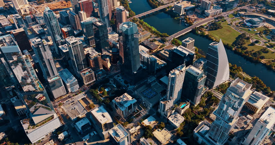 Flight over contemporary downtown Houston, Texas, USA. Approaching the waterfront of the Colorado River crossing the scenery.